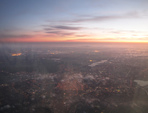 SX32598-9 Sunset from airplane over city lights.jpg
